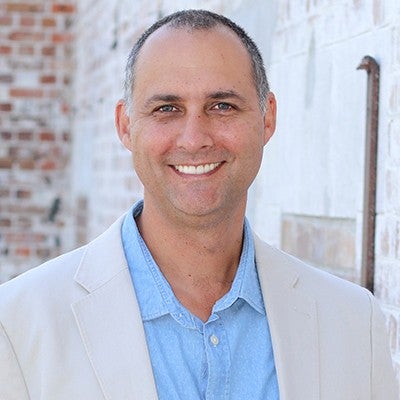 Portrait of Shaun Bond smiling.