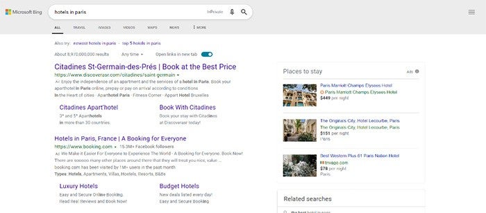 A Bing search about where to say in Paris with Hotel Prices Ads on the left and a pop-up column on the right with Microsoft Bing Images with more hotels.