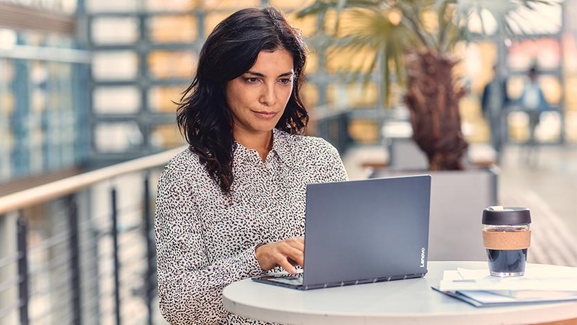 Female mobile professional on the go working on Lenovo Yoga C930 laptop. Back to school 2019.